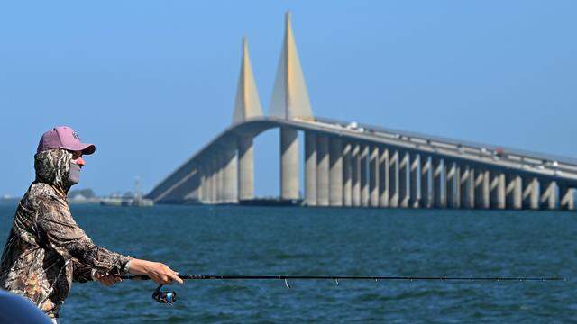 A visitor fishes from the South Skyway Fishing Pier on April 10, 2026. Florida Gov. Ron DeSantis announced on March 19, 2026, plans to demolish the South Skyway Bridge Fishing Pier and rebuild it adjacent to the present one, which has been damaged in hurricanes and storms.